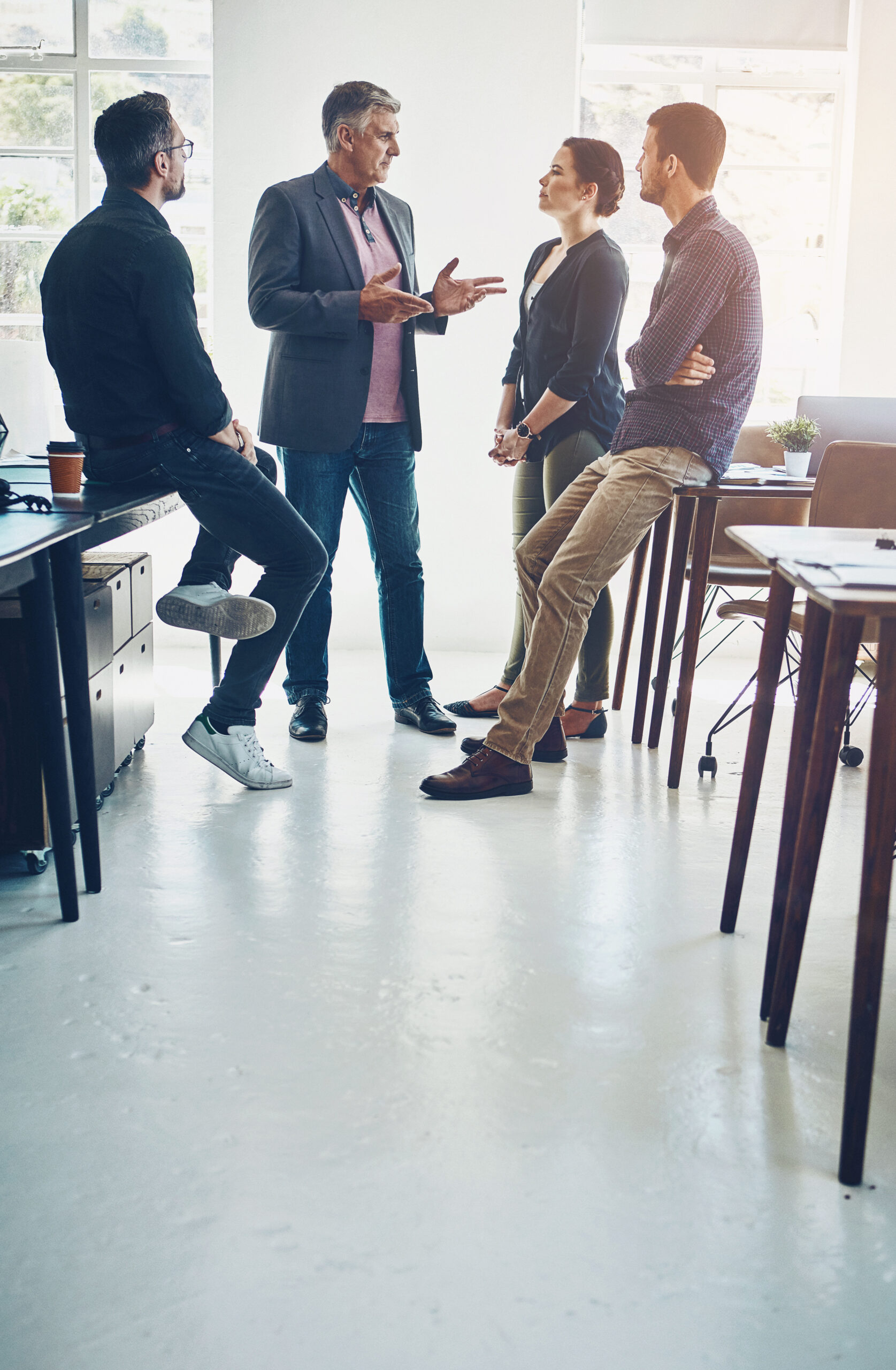 Group, people and web designer in company for discussion, brainstorming or conversation in office or workplace. Team, collaboration and business meeting for project, deadline and agency with mentor